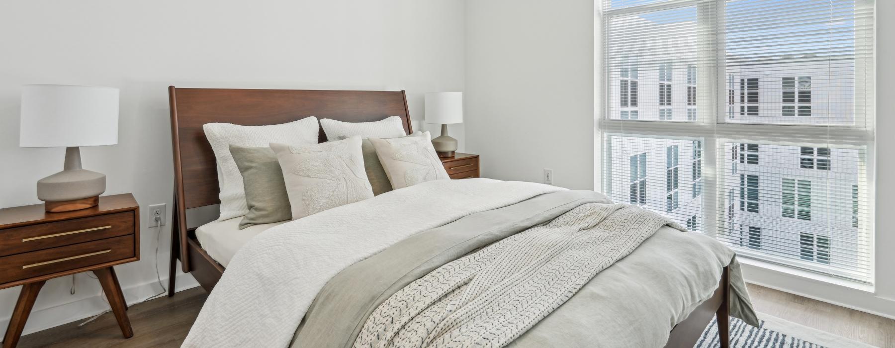 a bedroom with a large window